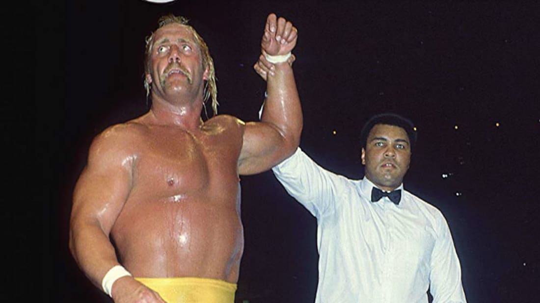 Hulk Hogan gets his hand raised by Muhammad Ali during the first WrestleMania in 1985.