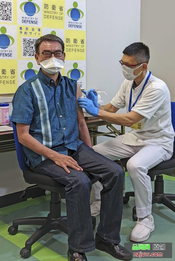 Former COVID-19 vaccine minister Taro Kono receives a booster shot in Tokyo on March 2. | KYODO